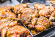 © Kristina Blokhin - Many whole chicken roasted closeup on tray in deli display store shop grocery brown with herbs, golden skin spicy, crispy