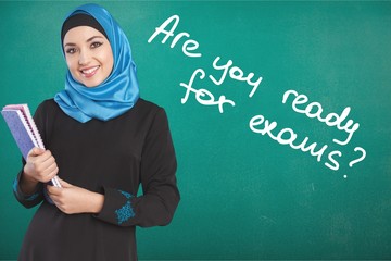 Wall Mural - Happy saudi Arab student holding folders isolated on a white