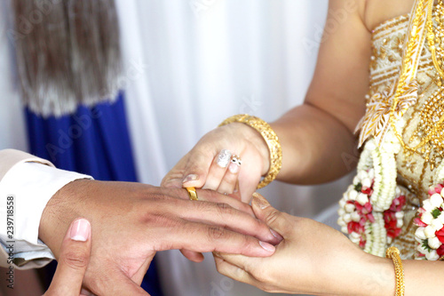 marriage thai wedding rings, bride put the wedding ring on groom, bride put  the ring on groom, thai wedding ceremony and wedding decoration of thailand  original marriage Stock Photo | Adobe Stock