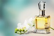 Perfume bottle and flowers isolated on  background.