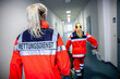 © filmbildfabrik - German paramedic runs in a floor to an accident