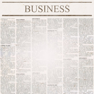 News newspaper with headline Business and old unreadable text