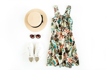 Woman summer clothes travel, collage on white background. Sundress-dress, straw hat, sneakers, sunglasses. Top view, flat lay.