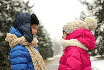 Sticker - Cute little children outdoors on snowy day