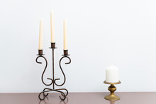 One Arm And Three Arms Candle Stick Holder, Two Candelabra Atop, On Top Of Furniture, Table Against White Wall In Living Room, House, Home Bedroom