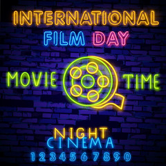 World Cinema Day December 28 illustration neon sing, label and logo. Cinema banner Design template, logo, emblem and label. Bright signboard, nightly bright advertising. Movie logo. 