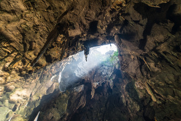 Sun Beam Through the Cave at Wat Tham Khao Luang, Phetchaburi, Thailand.