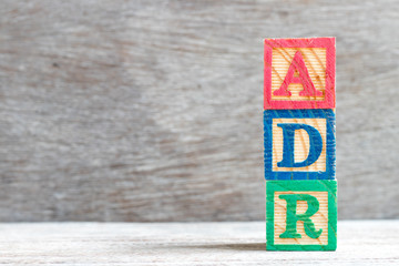 Canvas Print - Color letter block in word ADR (Abbreviation of adverse drug reaction) on wood background