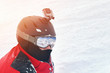 © Kirill Gorlov - Snowboarder or skier portrait in sport goggles and protection helmet with mounted action camera and ski slope on background. Exreme winter sport outdoor activities