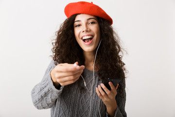 Canvas Print - Excited young woman wearing autumn clothes