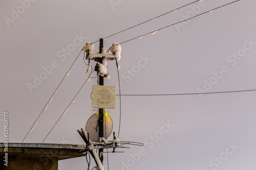 Fotografie, Obraz Frozen 5 GHz wireless repeater antennas pillar at winter night