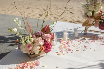 Wall Mural - Event decoration. Wedding chuppa at riverside decorated with fresh flowers. Florist workflow