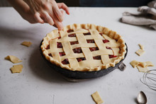 Uncooked Berry Pie With A Lattice Decoration On Top. Concrete Background, Cooking Process.