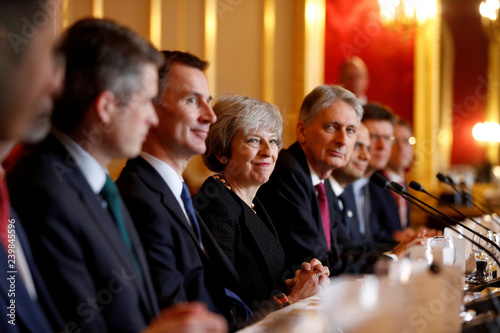 Britain S Prime Minister Theresa May Sits With Members Of Her
