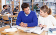 © JackF - Couple of students studying in library
