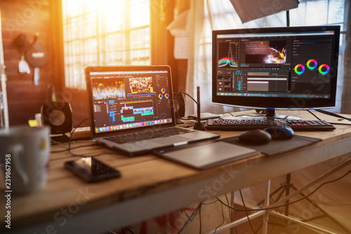 Fotomural Freelance desktop with laptop computer and monitor review for editor work with c