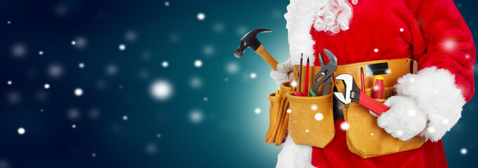 Santa Claus with a tool belt on winter background