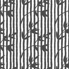 Seamless pattern with black silhouettes of stems of bamboo and branches with leaves on white background. Endless texture with floral exotic elements