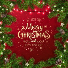 Wall Mural - creative frame made of christmas fir branches. gold merry christmas and new year text on red backgro