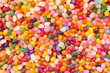 Bright, Festive And Colorful Background Or Texture Of Jelly Beans. Cheerful Mix Of Multiсolored Candies. Children's Holiday Concept. Top View.