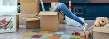 Young Woman Inside A Box While Preparing The Move