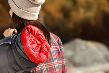 Sticker - Female camper with sleeping bag outdoors, closeup. Space for text