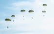 © Degimages - Many soldiers with parachutes in the sky.
