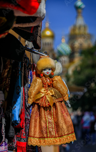 Fotografie, Obraz Russian doll dressed in a traditional winter outfit with a fur hat in a souvenir