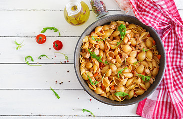 Italian pasta shells with meat and tomato sauce. Conchiglie pasta. Top view