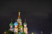 Colourful Saint Basilic Cathedral At Night In Moscow, Russia. Bright Onion Shaped Domes Isolated On A Black Background