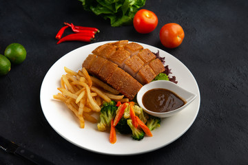 Wall Mural - chinese crispy pork belly on dark background