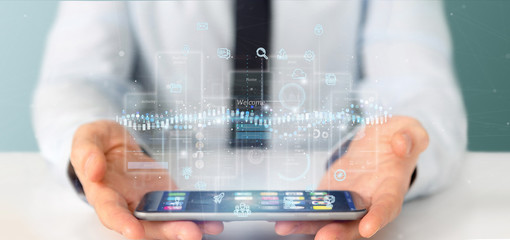 Poster - Businessman holding User interface screens with icon, stats and data 3d rendering