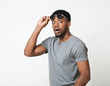© Prostock-studio - Surprised black man taking off his glasses
