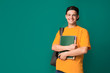 © Prostock-studio - Happy student with books and backpack over background