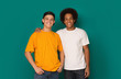 © Prostock-studio - Two best friends hugging and looking at camera over background