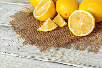 Pile of lemons on wooden table