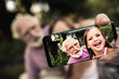 © Yakobchuk Olena - Grandfather with grandchild taking picture of themselves
