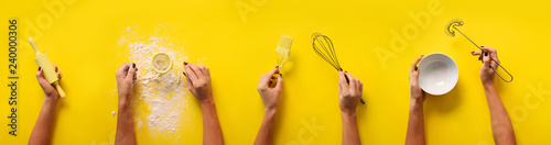Fotografía Female hands holding kitchen tools, sieve, rolling pin, bowl, sieve, brush, whisk, spatula for baking and cooking over yellow background