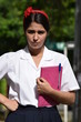 © dtiberio - Angry Cute Colombian Female Student With Notebook