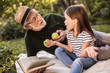 © Yakobchuk Olena - Grandfather with her preteen granddaughter on picnic