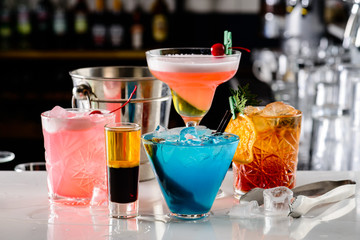 set of Classic alcoholic cocktails on bar counter in pup or restaurant