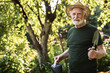 © Yakobchuk Olena - Old man working in garden in summer