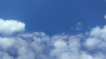 Wall Mural - flying in the clouds, camera movement through the clouds, video loop