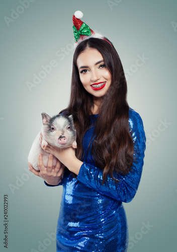 Smiling Christmas Woman In Blue Dress With Little Pig Smile And