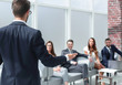 © ASDF - businessman holds a briefing with the business team