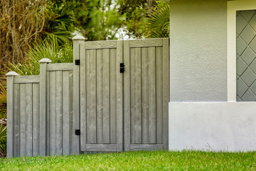 Wall Mural - Double Gates of Gray Composite Fence