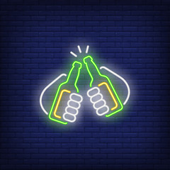 Two hands holding and clinking beer bottles neon sign. Party design element. Night bright neon sign, colorful billboard, light banner. Vector illustration in neon style.