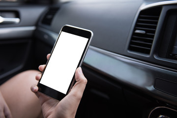 Aufkleber - Hand using blank white screen mobile smartphone inside a car in sunny day, copy space for your app or product display,