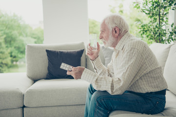 Sticker - Profile side view portrait of sad tired stylish old man sitting 