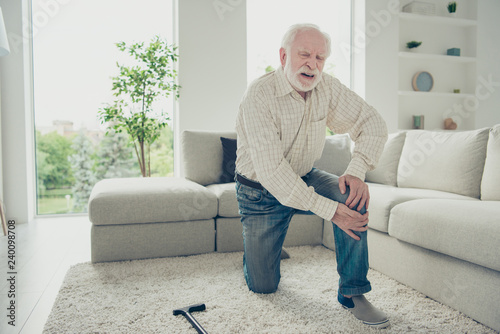 Fotografía Sad tired annoyed stylish old man wearing checked shirt on carpe